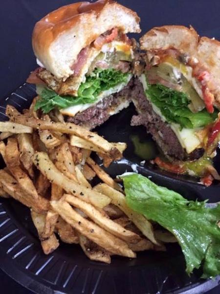 Enjoy a delicious burger back stage from Ned's Catering. 